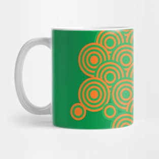 op art pattern retro circles in green and orange Mug